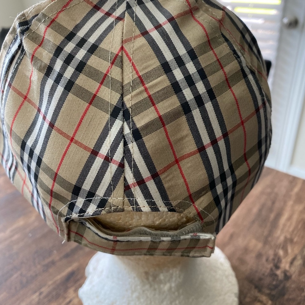 Women’s cap tan black red white stripes.